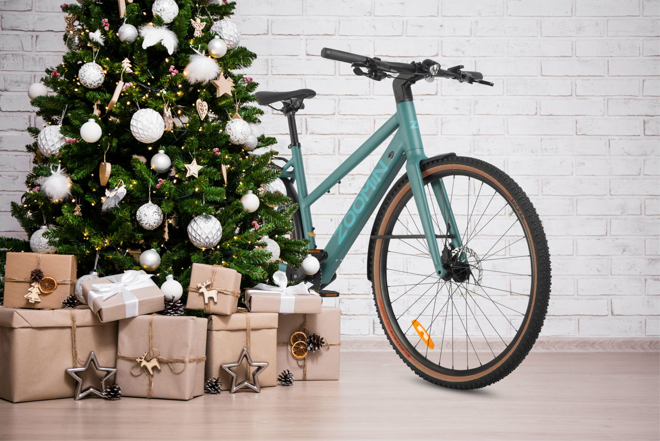 Zoomin Z1 in teal sitting behind a Christmas tree